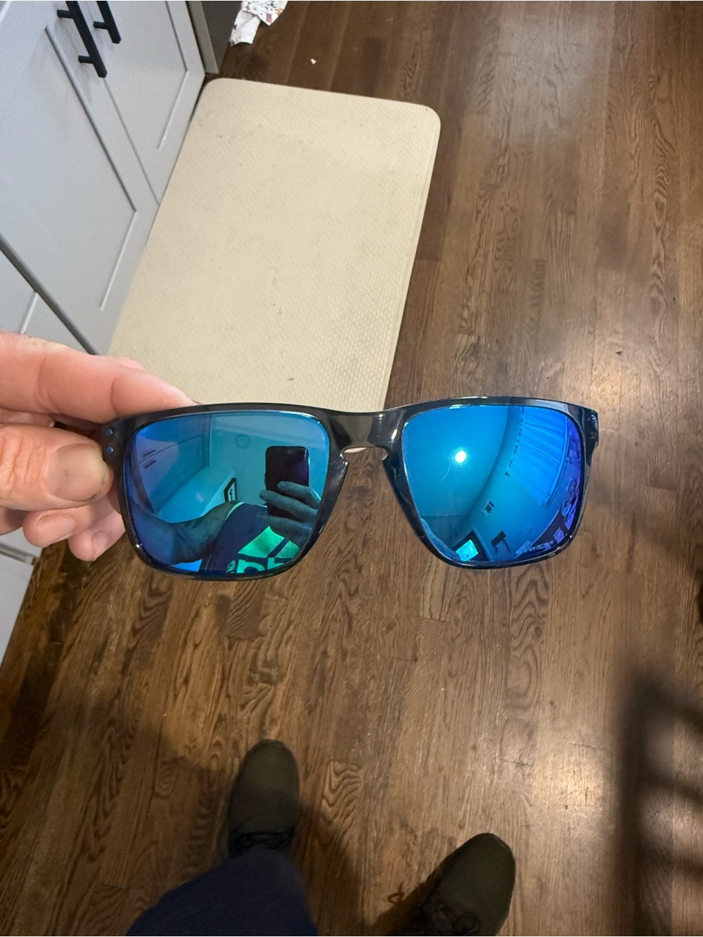 Oakley Black Frame Sunglasses with Blue Mirrored Lenses